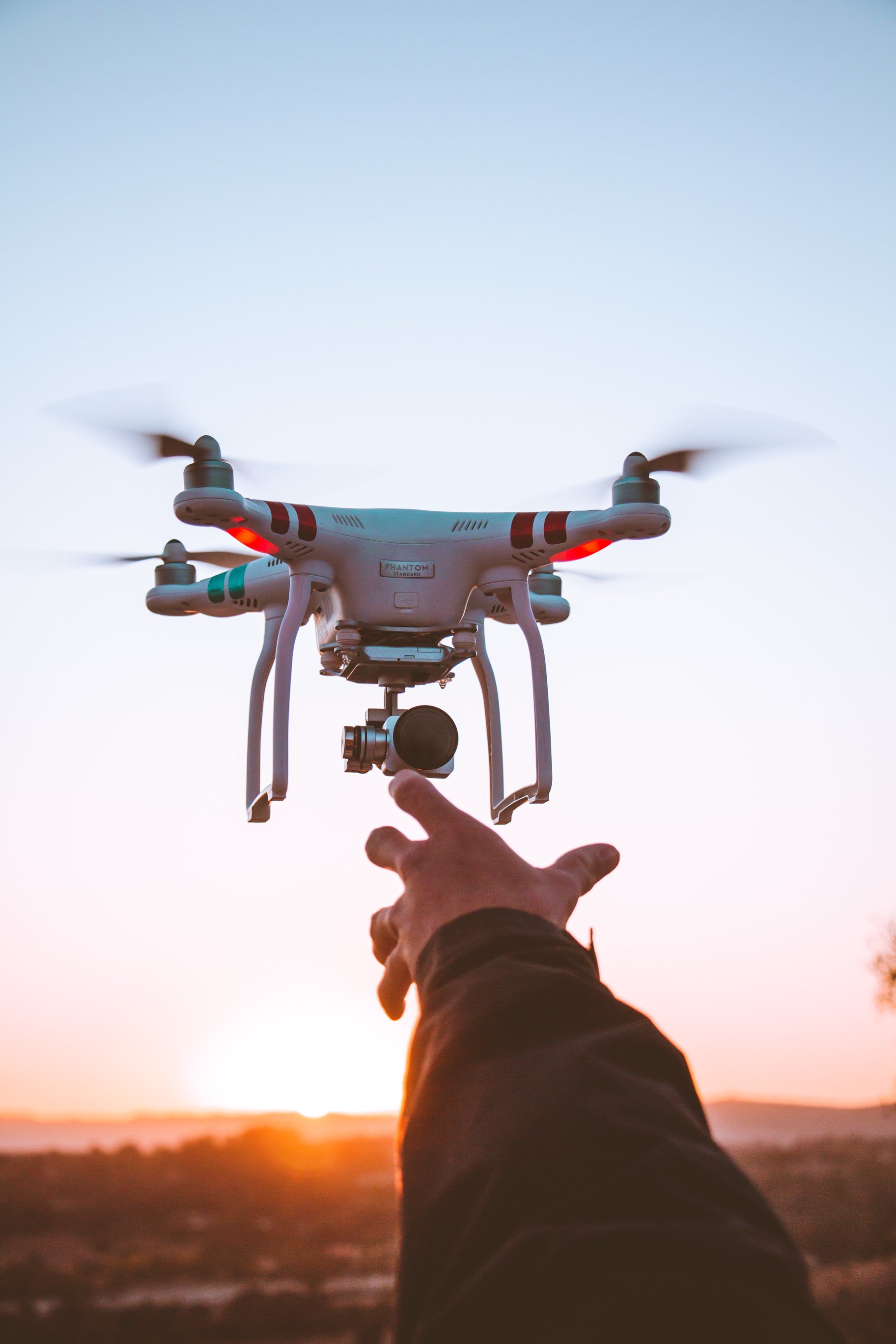 White and Red Quadcopter Drone Close-up Photography